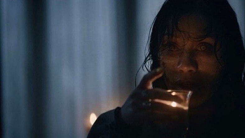 First Look at a Deadite in 'Evil Dead Burns' as She Drinks Hot Wax!