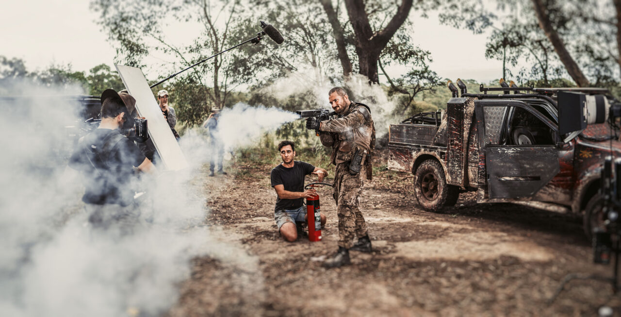 RHYS Luke McKenzie fires a Wak Stik next to SFX Supervisor Tim Namour Photo By Thom Davies scaled - 'Wyrmwood: Apocalypse': Wholesome New Images Are Covered In Bloody Guts [Exclusive]