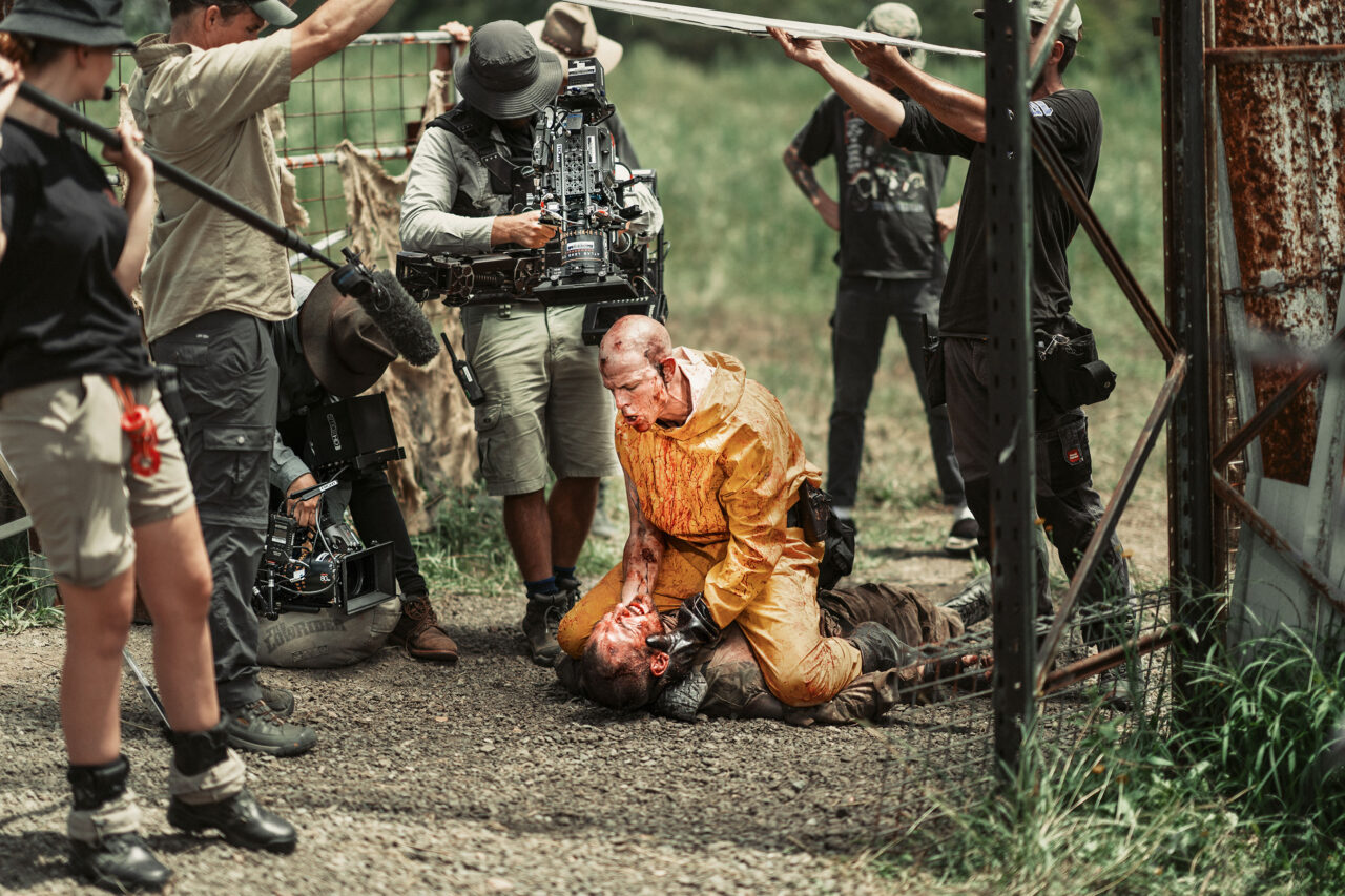 THE SURGEON Nick Boshier Photo By Thom Davies scaled - 'Wyrmwood: Apocalypse': Wholesome New Images Are Covered In Bloody Guts [Exclusive]