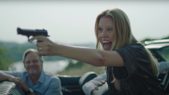 Mia Goth with a gun in Infinity Pool